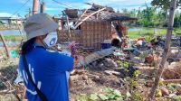 HI-Projektleiterin Melanie Ruiz steht nach dem Taifun Rai vor einem verwüsteten Zuhause.
